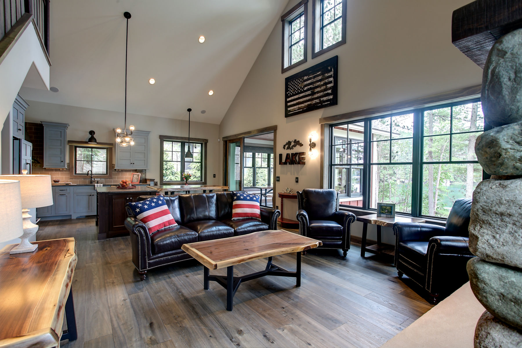 The Lodge's open-plan great room with comfortable seating and lake-facing windows