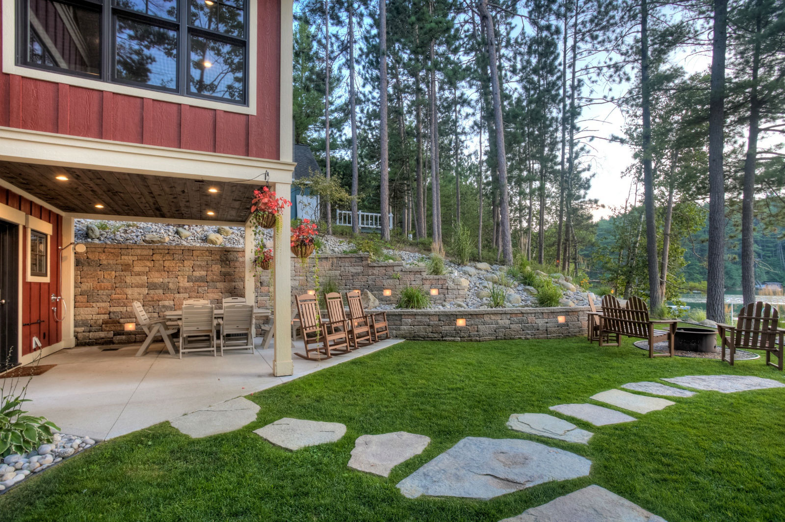 The Lodge's lakeside lawn sloping down to Arbutus Lake at golden hour