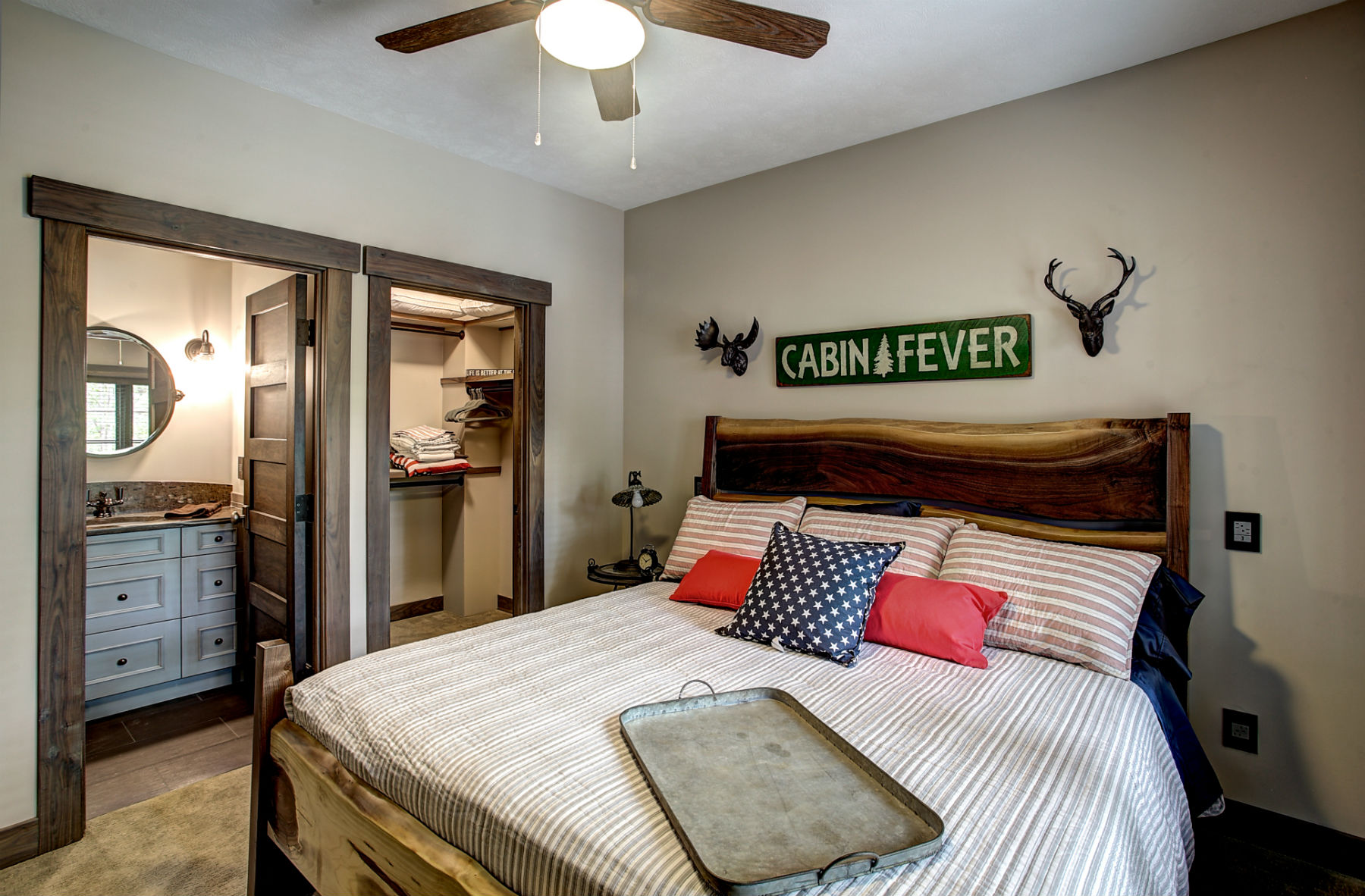 A cozy, light-filled bedroom inside The Cabin at Lakemore Retreat